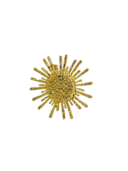 Broche de rayos de sol dorados